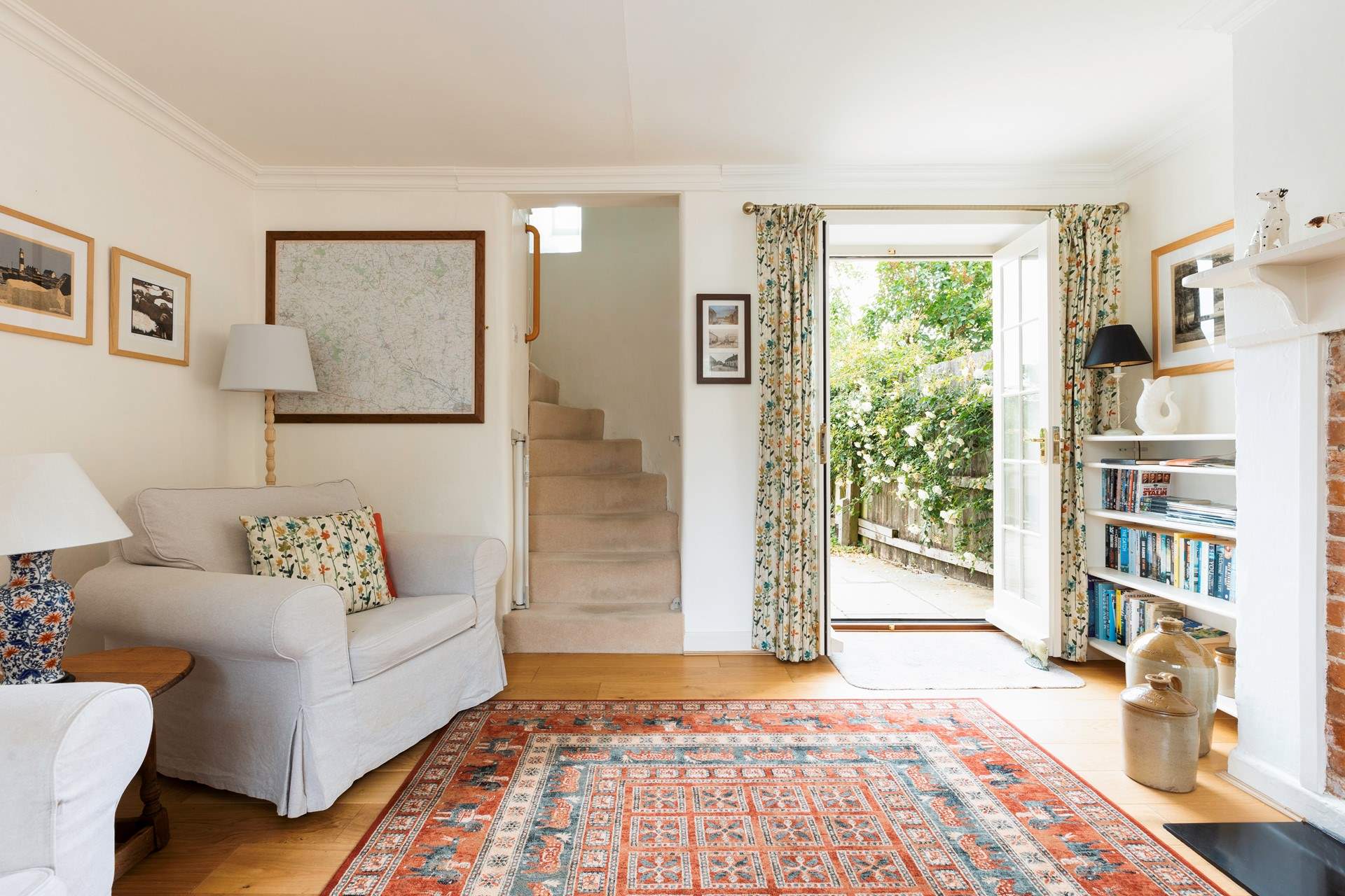 The beautiful turning staircase leads from the sitting-room.