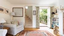 The beautiful turning staircase leads from the sitting-room.