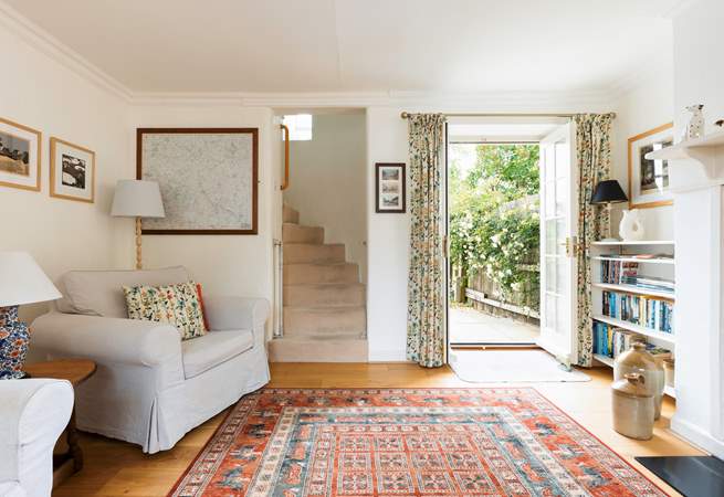 The beautiful turning staircase leads from the sitting-room.