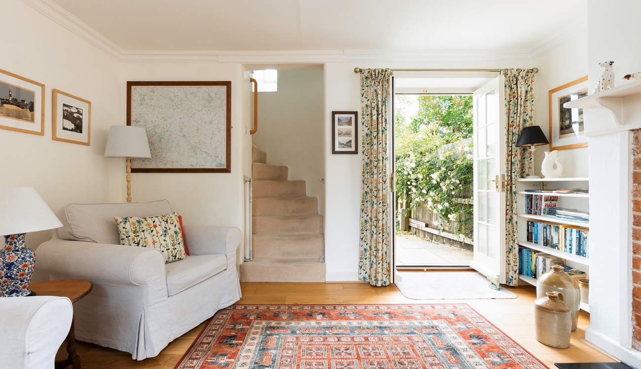 The beautiful turning staircase leads from the sitting-room.