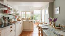 The stylish kitchen/dining-room leads out into the conservatory.