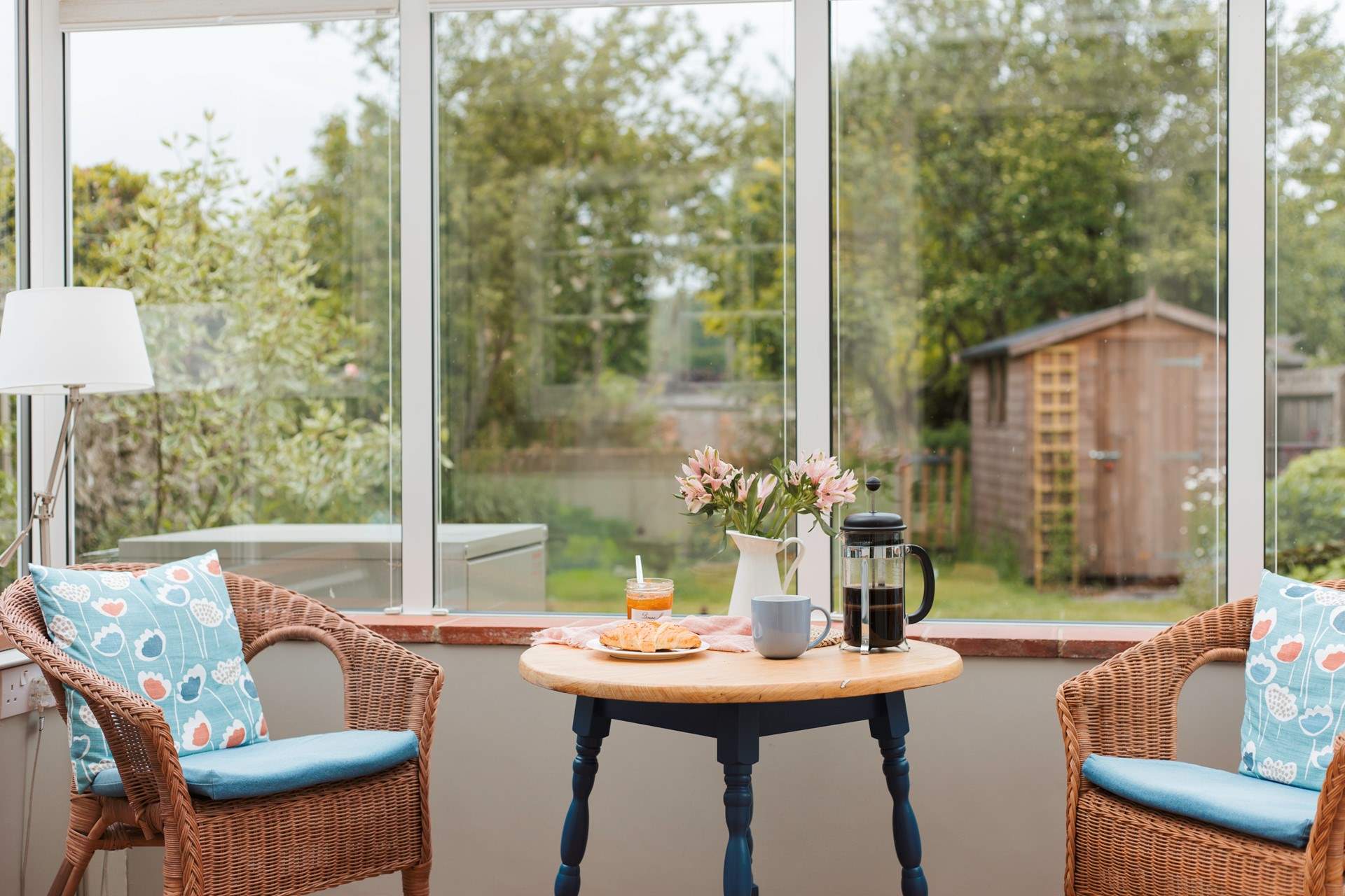 The conservatory looks out over the enclosed south-west facing garden.