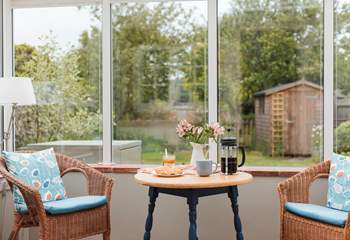 The conservatory looks out over the enclosed south-west facing garden.