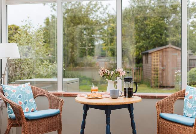 The conservatory looks out over the enclosed south-west facing garden.