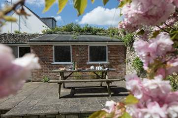 Right at the bottom of the garden is a sun terrace, with lovely views. The building behind is for storage only.