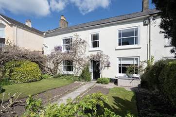 This elegant house is set back from the main street that runs through the village of Charmouth.