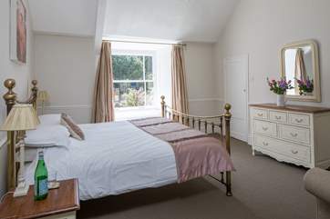 The master bedroom looks out over the church opposite. It has a super-king size bed and sea glimpses.