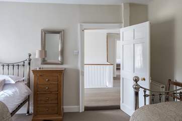 Bedroom 4, this door through to the landing can be locked to create a family suite with bedroom 2, then accessed via the spiral stairs.