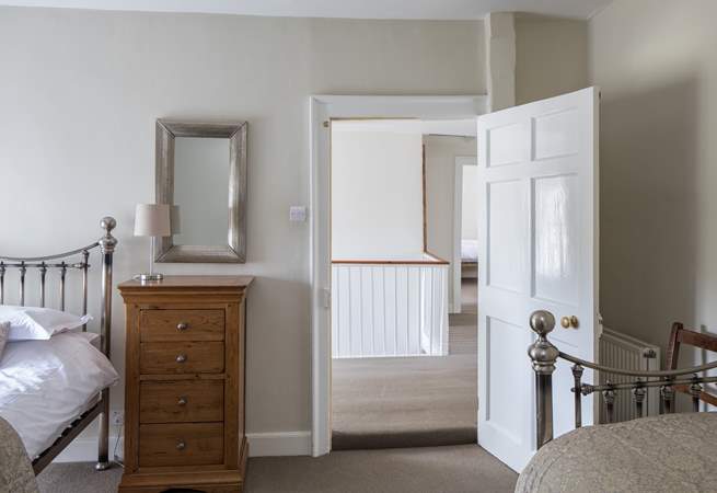Bedroom 4, this door through to the landing can be locked to create a family suite with bedroom 2, then accessed via the spiral stairs.