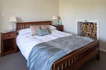 Bedroom 2 has a king-size 5' bed and views over the little patio-area at the back of the house.