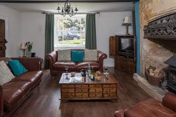 The elegant sitting-room has a cosy wood-burner for chilly evenings.