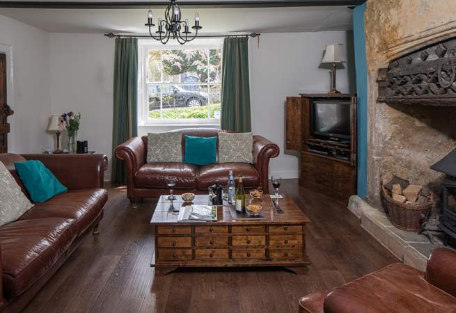 The elegant sitting-room has a cosy wood-burner for chilly evenings.