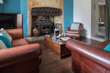 The sitting-room has this magnificent fireplace and wood-burner.