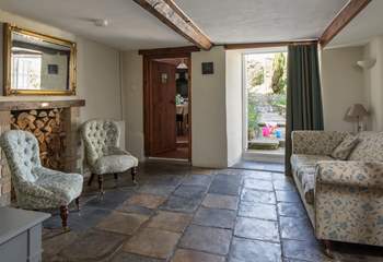 The snug with original stone flooring and French doors onto the patio-area.