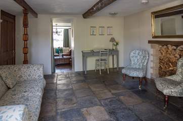 The snug leads from the dining-area into the sitting-room and the hallway.
