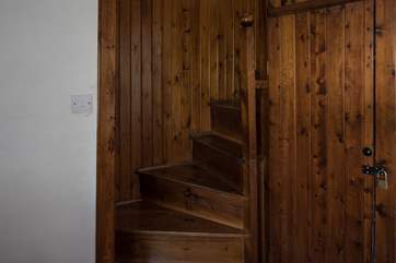 The spiral stairs that lead to bedrooms 2 and 4, which can be used as a suite. Both rooms can also be accessed via the main staircase.