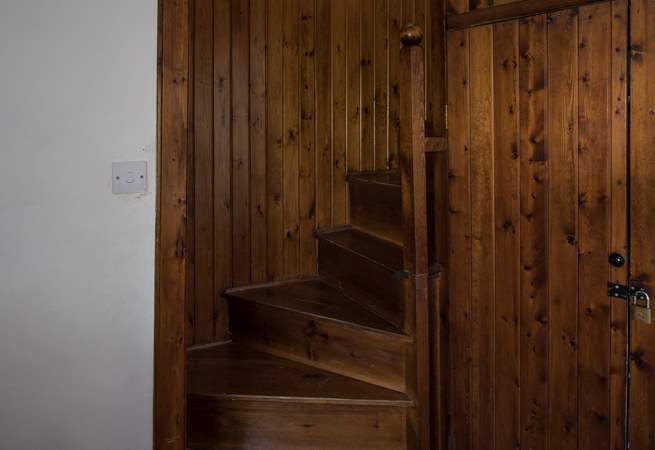 The spiral stairs that lead to bedrooms 2 and 4, which can be used as a suite. Both rooms can also be accessed via the main staircase.