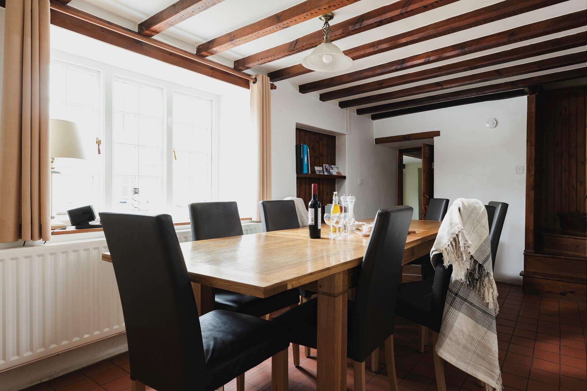 Perfect for family gatherings and celebrations, the large oak table seats 10.