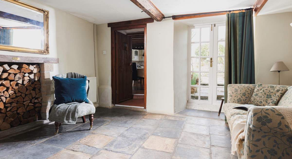 The snug with original stone flooring and French doors onto the patio-area.