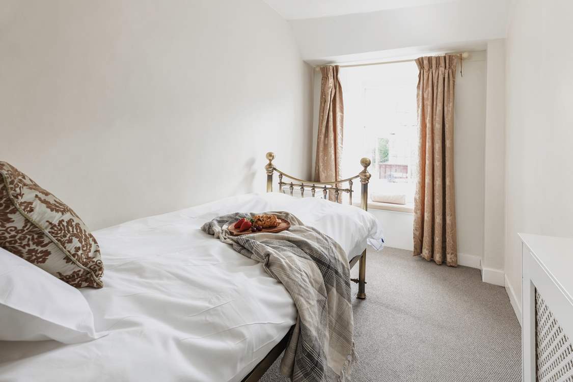 Bedroom 5, the little single room looks out over the church and has sea glimpses.
