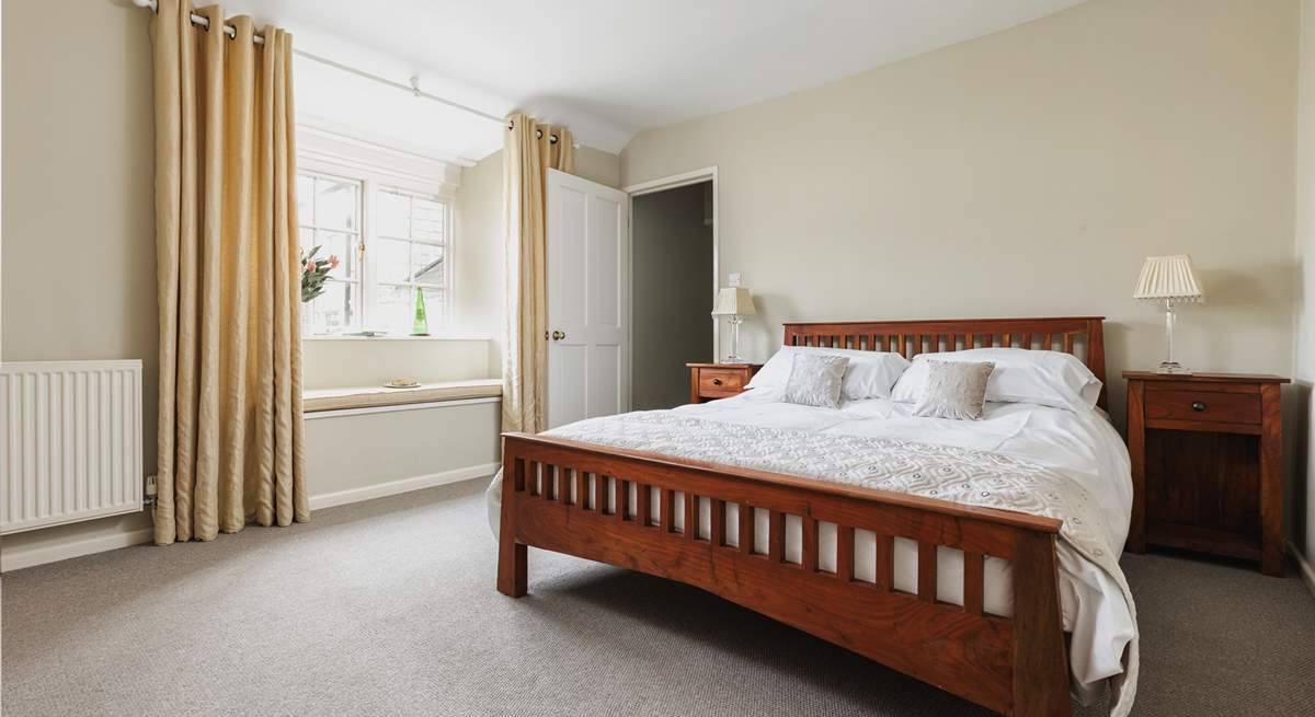 Bedroom 2 has a king-size 5' bed and views over the little patio-area at the back of the house.