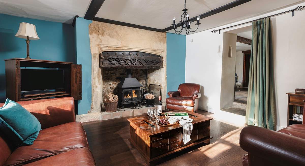 The sitting-room has this magnificent fireplace and wood-burner.