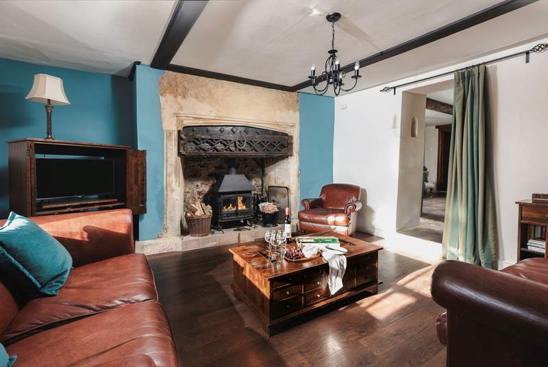 The sitting-room has this magnificent fireplace and wood-burner.