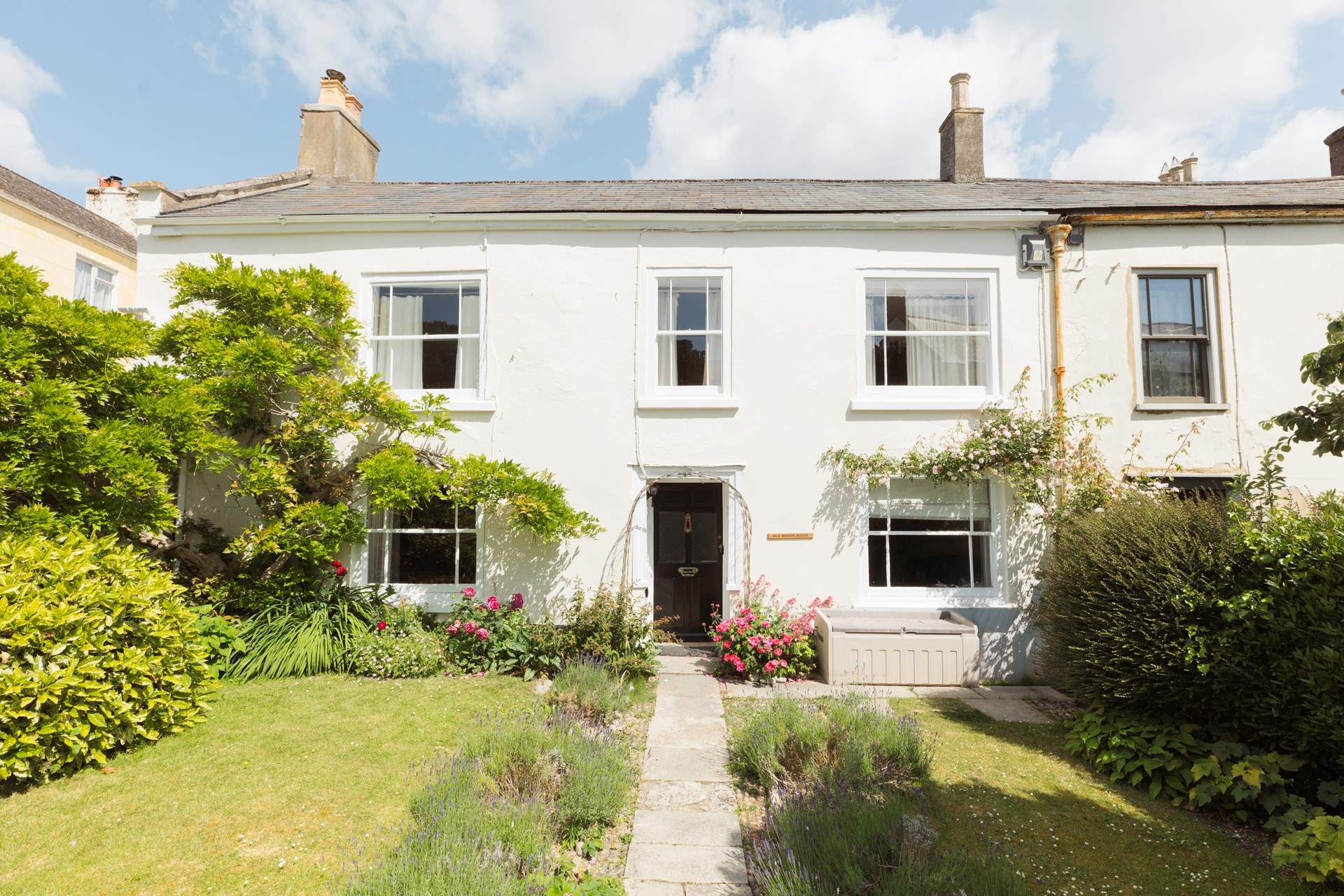 The Old Manor House is a 16th Century Grade II Listed family house set back from the road, with a fabulous garden behind the house.