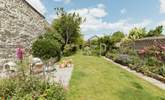 Up from the lower patio the carefully landscaped garden runs off into the distance... - Thumbnail Image