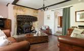The stunning sitting-room has this magnificent fireplace and wood-burner. - Thumbnail Image