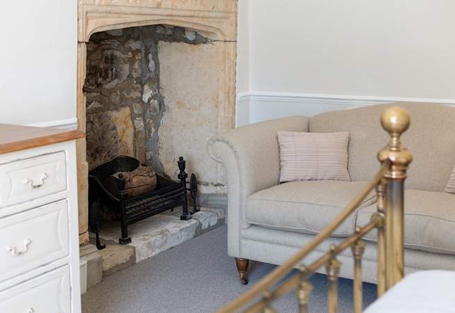 Stunning original features are found all around the property. This beautiful fireplace is in the main bedroom.