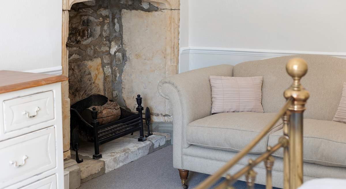 Stunning original features are found all around the property. This beautiful fireplace is in the main bedroom.