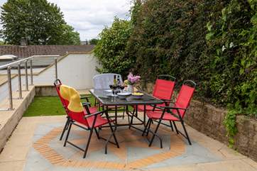 Enjoy a meal outside in the garden which is shared with next door, perhaps you can share holiday tips.
