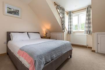 This bedroom over looks the garden at the back of the house (Bedroom 3).