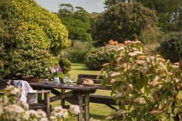 Enjoy a glass of wine and look out over the tranquil garden.