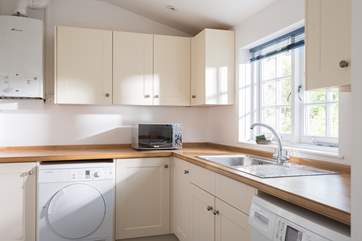 The utility-room off the kitchen is great for all your beach or walking gear.