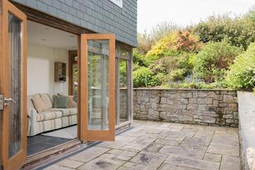 Double doors open from the conservatory.