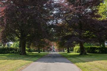 As you sweep up the drive, the mansion house is in front of you, formerly owned by Sir Henry Peek.