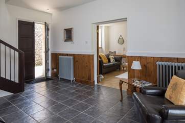 The entrance hall has a small cloakroom beneath the stairs.