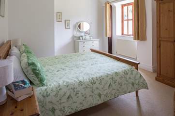Bedroom 2 has a 5ft bed and looks out over the garden and church in the distance.