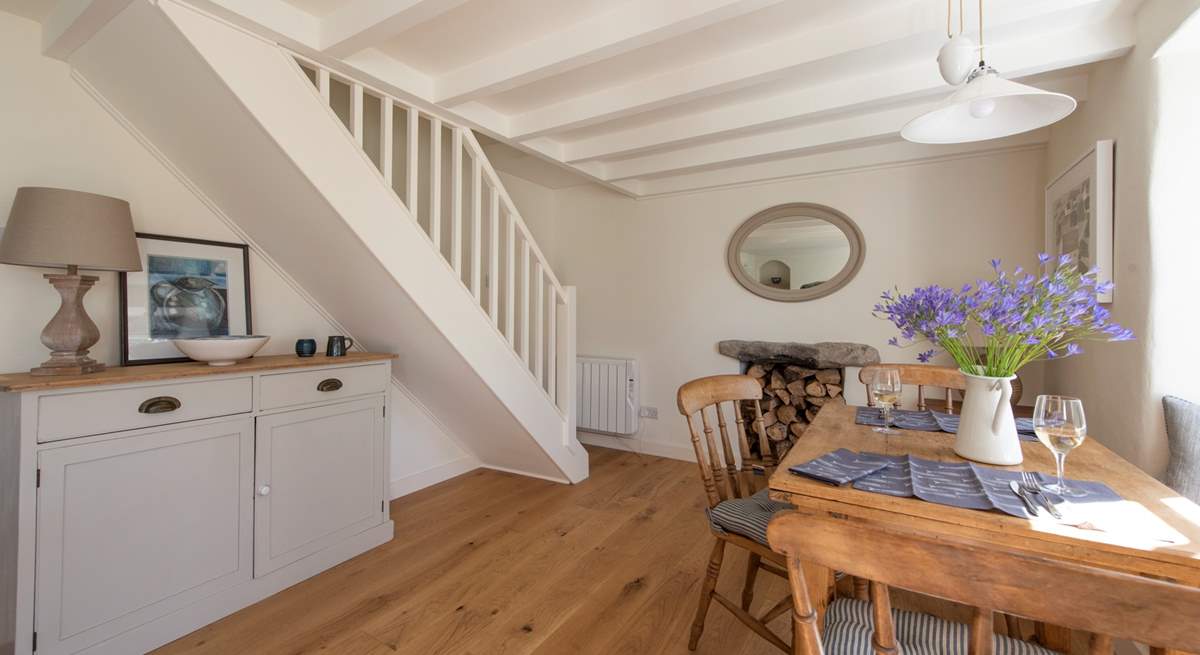 Stairs lead up to the bedrooms and bathroom.