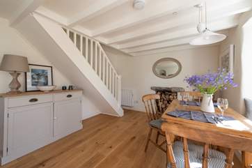 Stairs lead up to the bedrooms and bathroom.