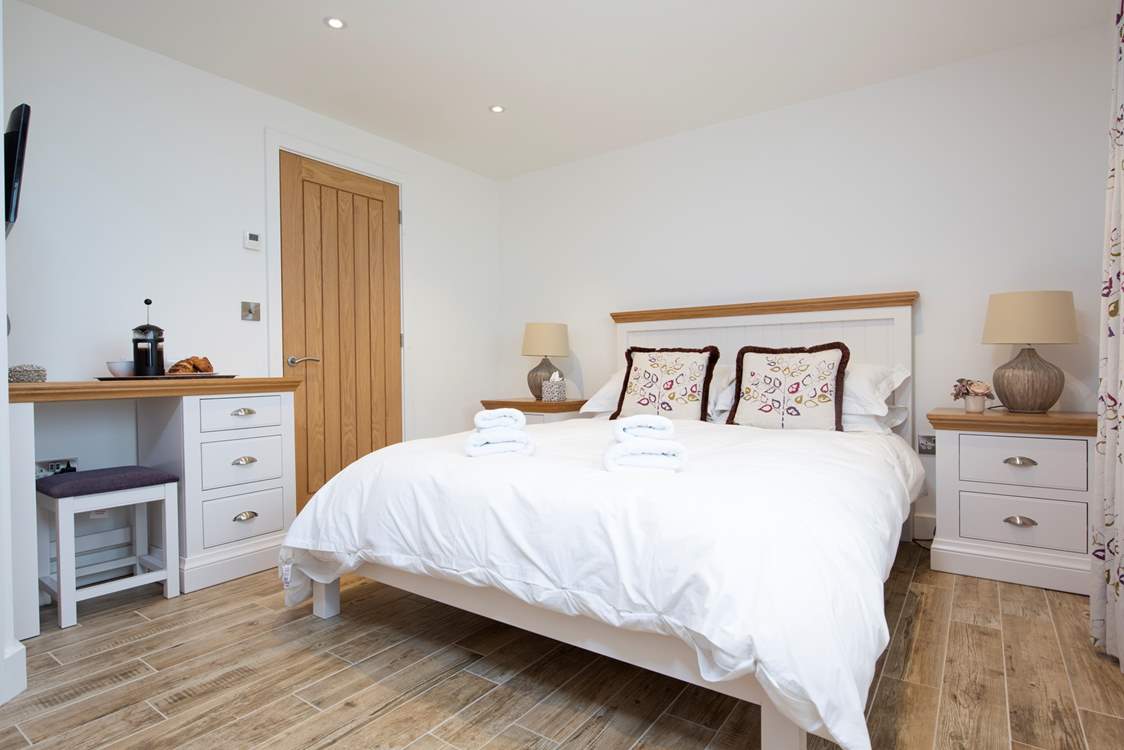 The double bedroom has a king-size bed and exquisite linens.