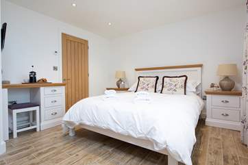 The double bedroom has a king-size bed and exquisite linens.