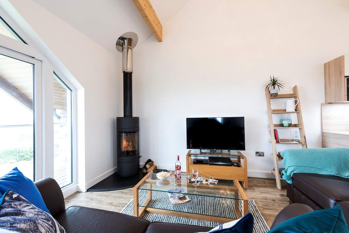 A roaring wood-burner in the corner of the sitting-area.