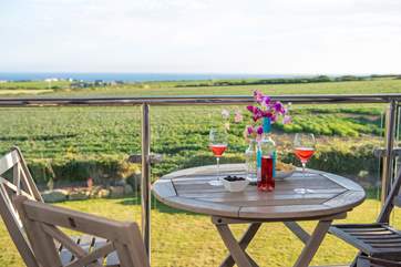 Enjoy the view and sunshine on the balcony.