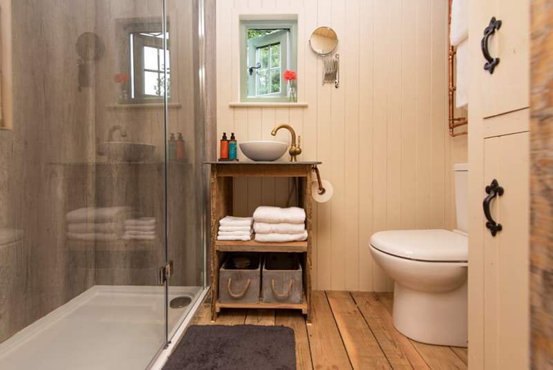 The ensuite shower room sits to the left of the hut and has everything you need to freshen up. 