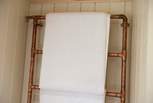 There is even a unique heated copper towel-rail!
