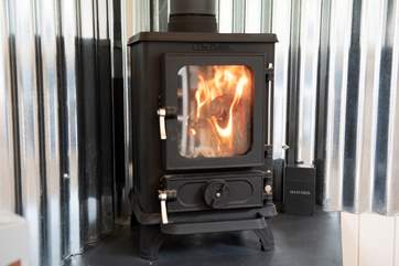 The sweet little wood-burner will keep you nice and toasty in the cooler months.