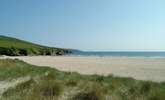 Discover sheltered bays and beaches along this stunning stretch of coastline. - Thumbnail Image